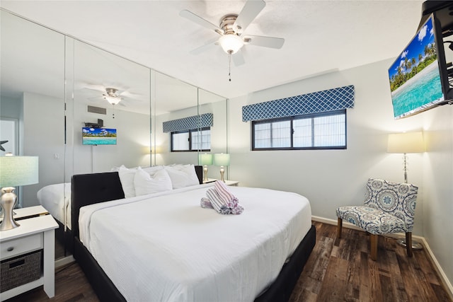 bedroom featuring ceiling fan and dark wood-type flooring