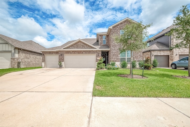 view of front of house featuring a garage and a front yard