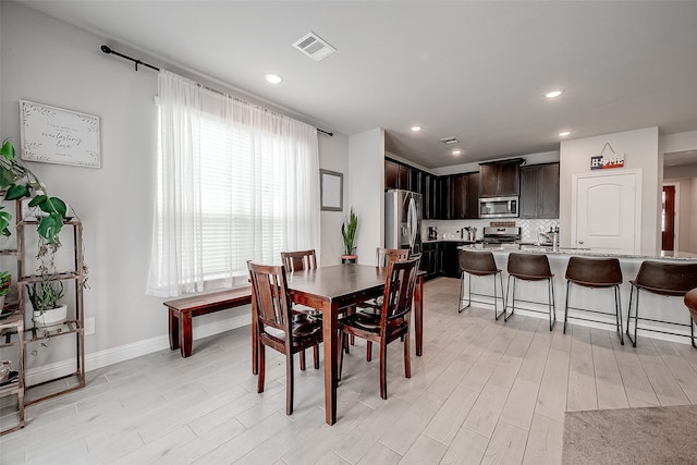 dining room featuring light hardwood / wood-style flooring