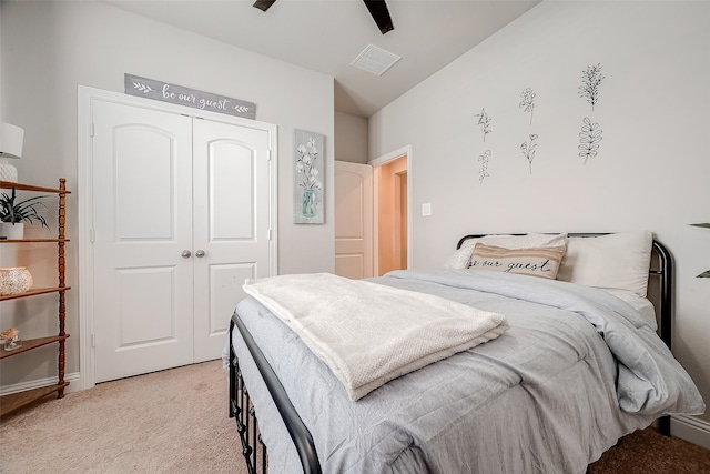 carpeted bedroom with a closet and ceiling fan