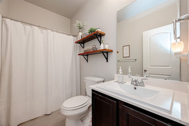 bathroom with wood-type flooring, a shower with curtain, vanity, and toilet