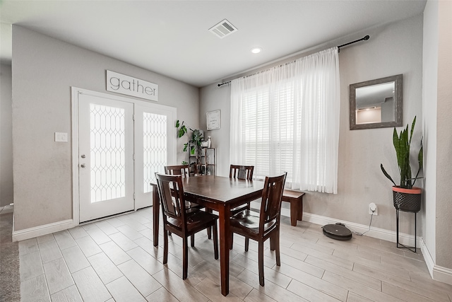 dining area with light hardwood / wood-style flooring