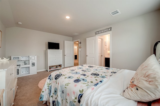 carpeted bedroom with connected bathroom