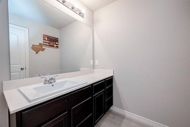 4731 Seabourne Landing Dr, Rosenberg, TX 77469 - bathroom featuring baseboards, wood finished floors, and vanity