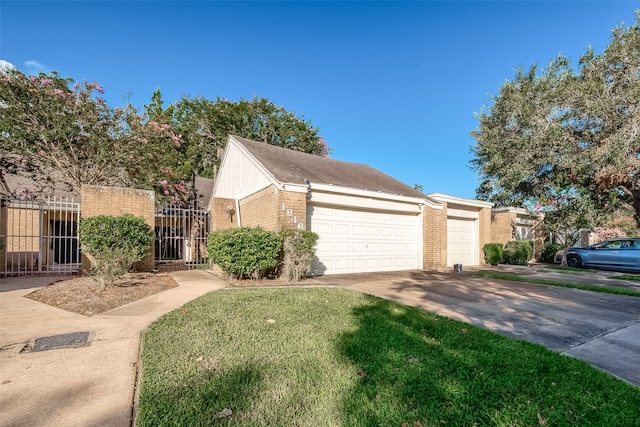 view of front of home featuring a front yard and a garage