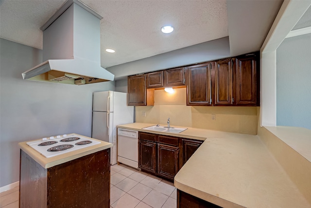 kitchen featuring white appliances, kitchen peninsula, exhaust hood, and sink