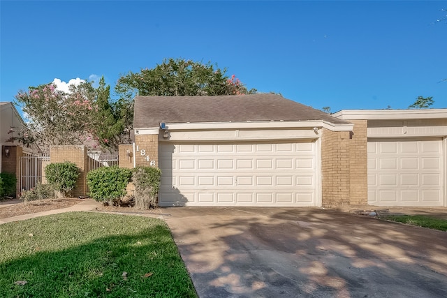 single story home featuring a garage