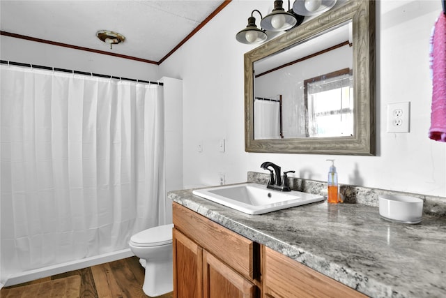 bathroom featuring hardwood / wood-style flooring, a shower with curtain, ornamental molding, vanity, and toilet