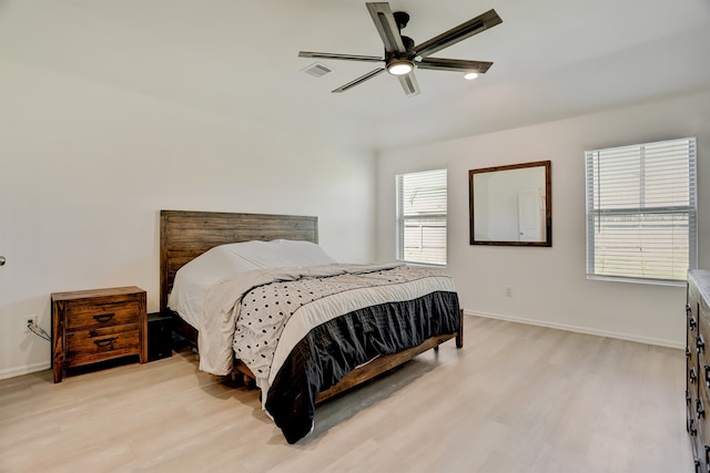 bedroom with ceiling fan and light hardwood / wood-style floors