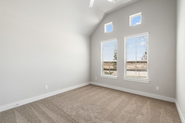 carpeted spare room with lofted ceiling and ceiling fan