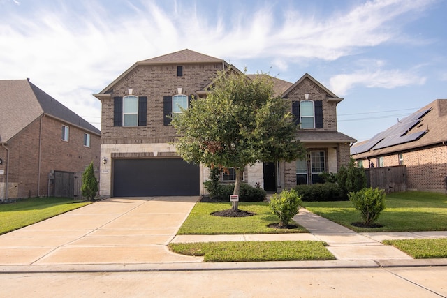 view of front facade with a front lawn and a garage