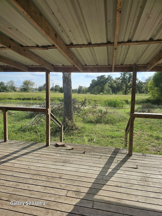 wooden terrace with a rural view