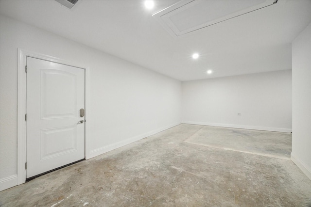 unfurnished room with visible vents, baseboards, and concrete flooring