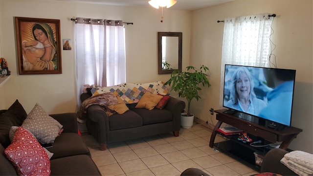 living room with ceiling fan and light tile patterned floors