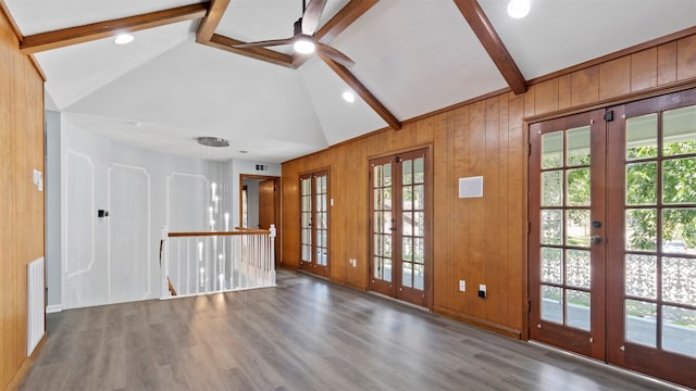 unfurnished room featuring french doors, lofted ceiling with beams, and dark hardwood / wood-style flooring