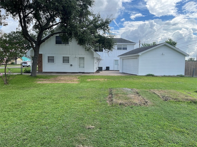 rear view of house featuring a yard