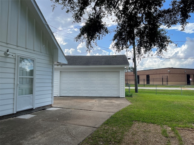 garage featuring a yard