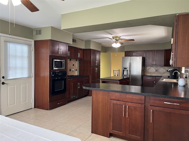 kitchen with decorative backsplash, sink, ceiling fan, and stainless steel appliances