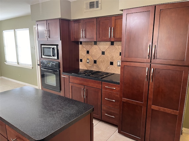 kitchen with black appliances, decorative backsplash, and light tile patterned floors