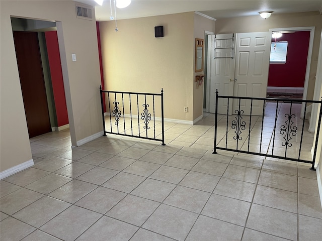 empty room with light tile patterned flooring