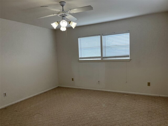 unfurnished room with ceiling fan and carpet floors