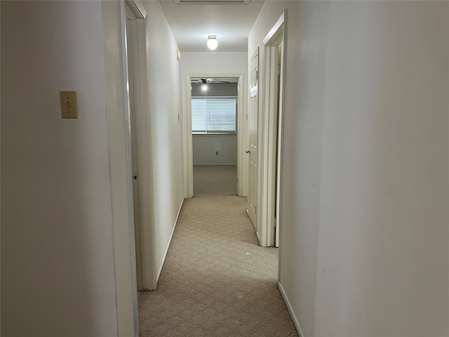 hallway with light carpet