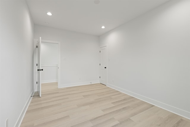 spare room with light hardwood / wood-style flooring