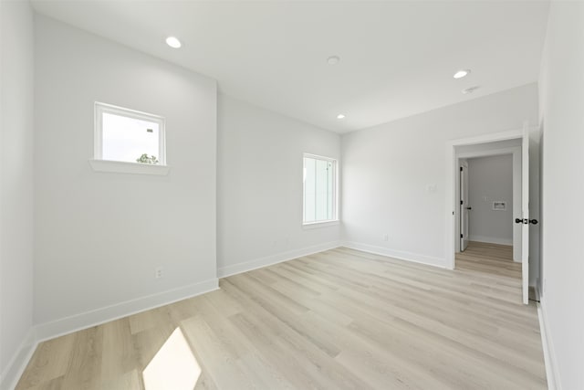 spare room with light wood-type flooring