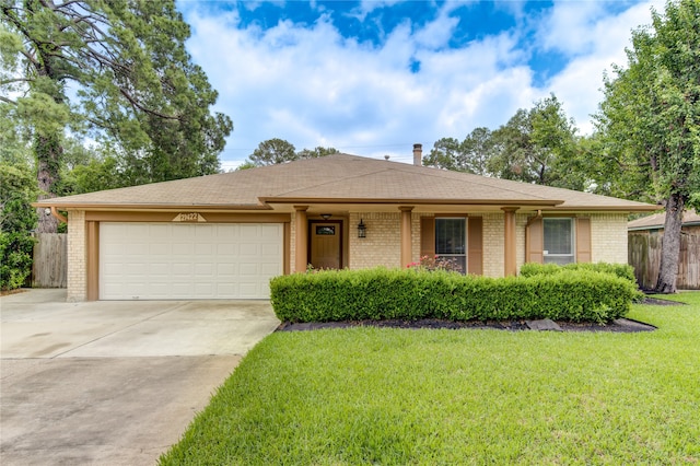 ranch-style home with a front yard and a garage