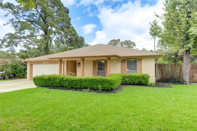 single story home with a front yard and a garage