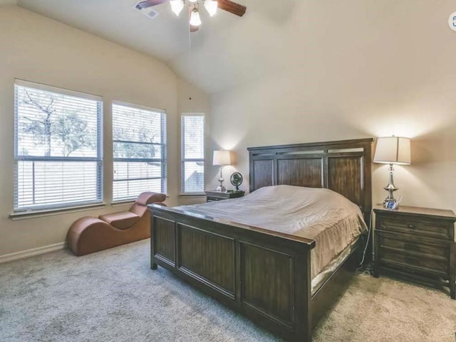 bedroom with lofted ceiling, light colored carpet, and ceiling fan