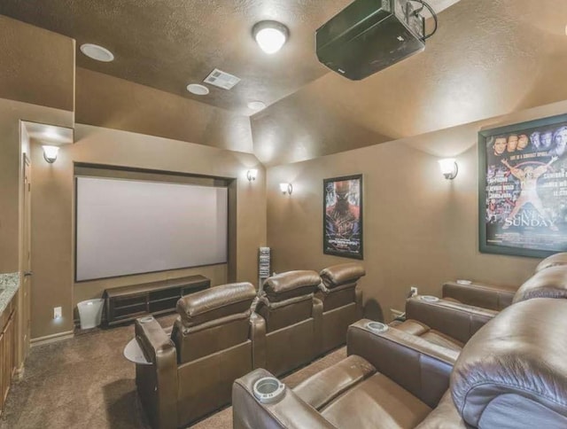 cinema room featuring carpet and a textured ceiling