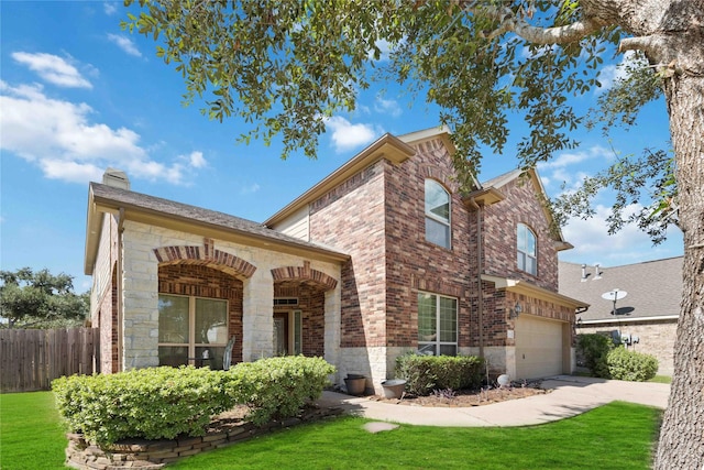 view of front of property with a front yard and a garage