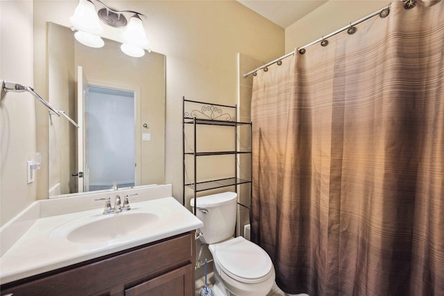 bathroom with toilet and vanity