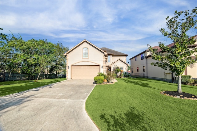 view of front of house with a front yard and a garage