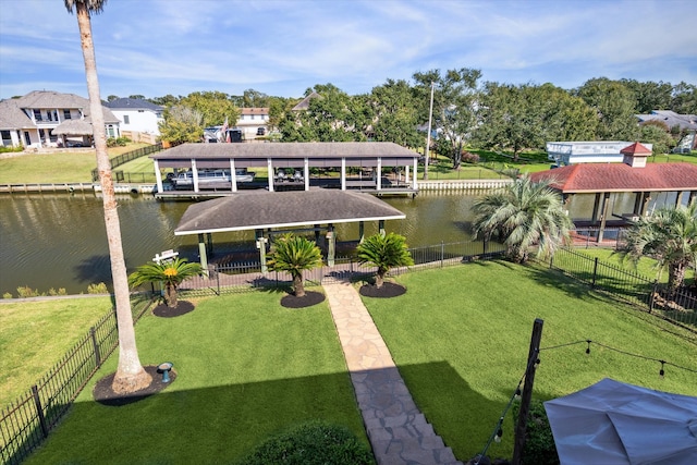 exterior space with a water view and a yard