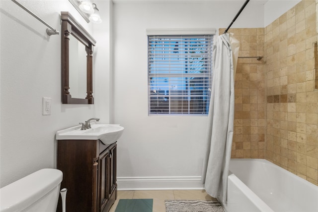 full bathroom with tile patterned floors, vanity, shower / tub combo, and toilet