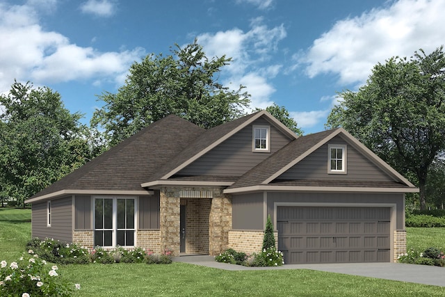 view of front of house with a front yard and a garage