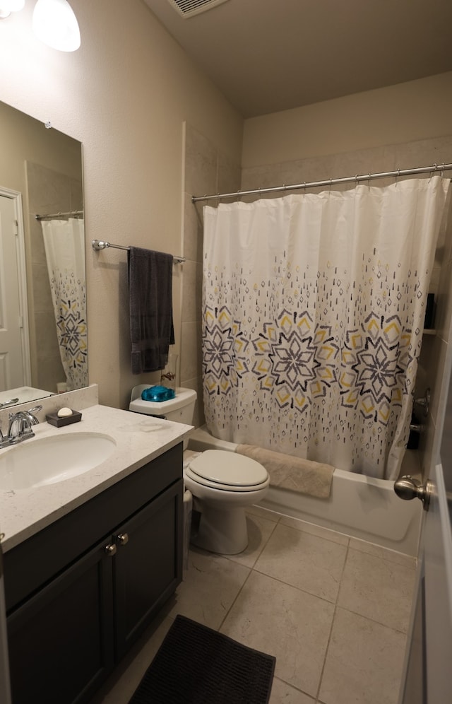 full bathroom with tile patterned flooring, vanity, toilet, and shower / bath combination with curtain