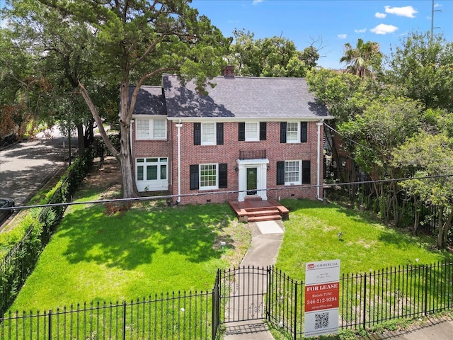 colonial home with a front lawn