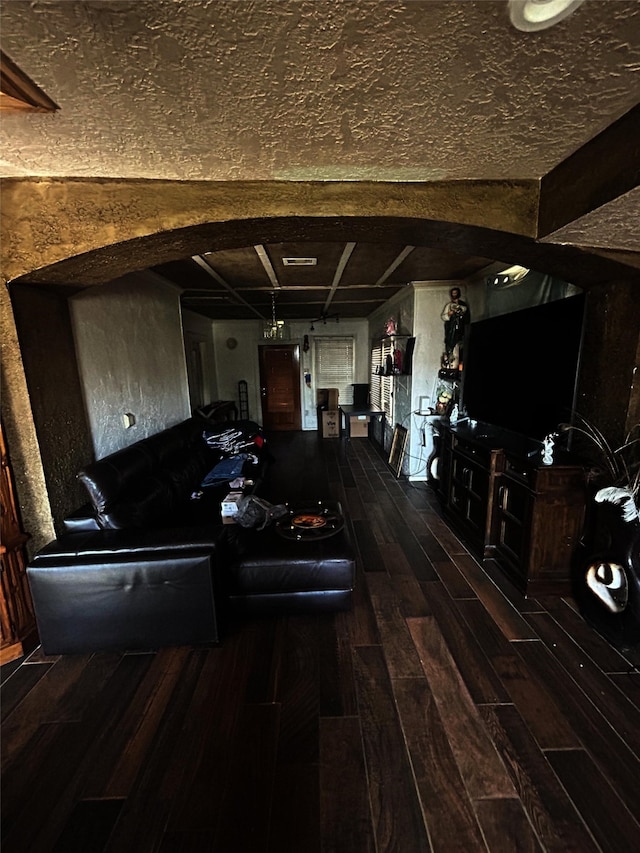 living room with wood-type flooring and beam ceiling