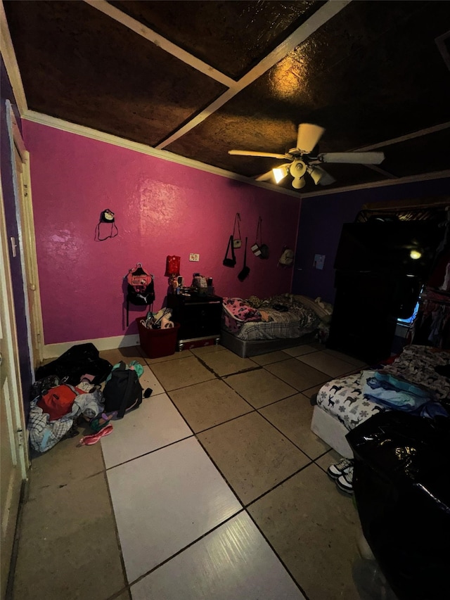 unfurnished bedroom featuring ceiling fan, tile patterned floors, and crown molding