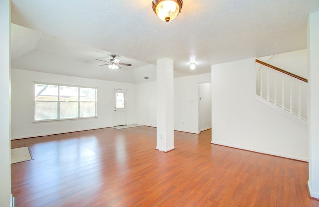 interior space featuring a textured ceiling, wood-type flooring, and ceiling fan