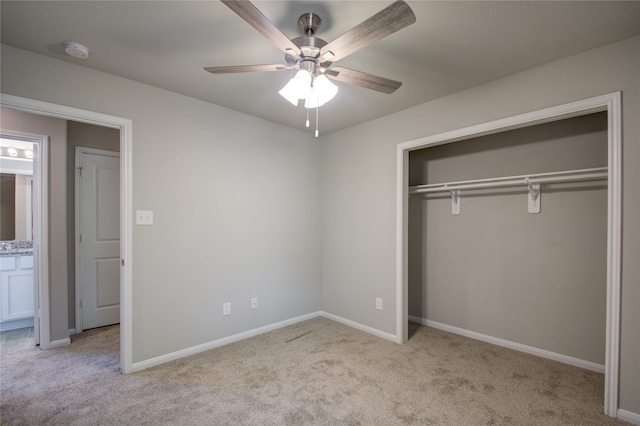 unfurnished bedroom with ceiling fan, a closet, and light carpet