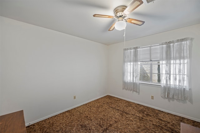 spare room featuring ceiling fan and carpet flooring