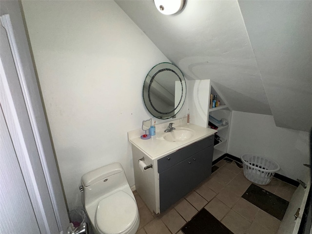 bathroom with vanity, toilet, and tile patterned floors