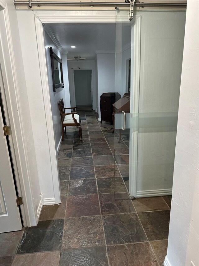 hallway featuring ornamental molding