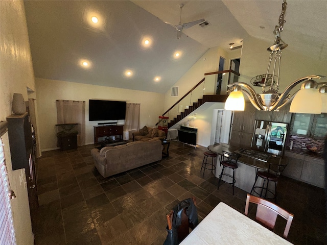 living room with high vaulted ceiling and ceiling fan