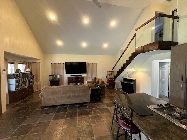 living room featuring high vaulted ceiling