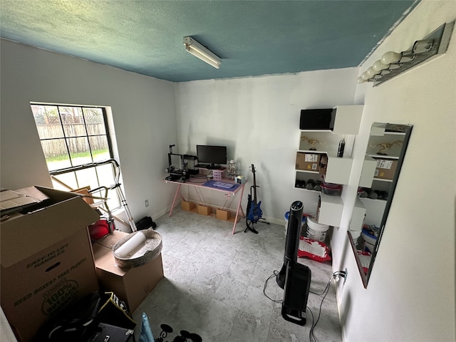 office space with a textured ceiling